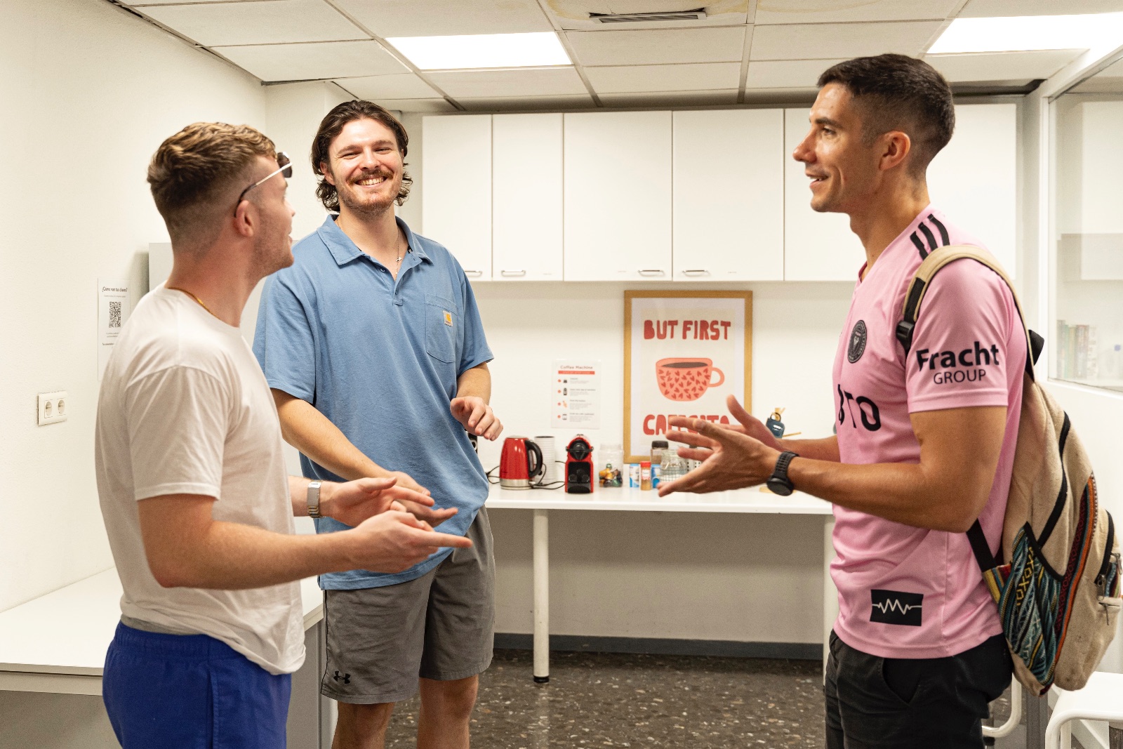 Gap year students talking in Iberia Language Academy's kitchen